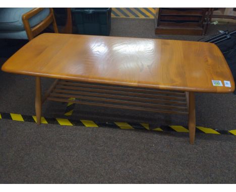 Blonde Ercol Windsor coffee table with magazine shelf, 104cm length2 small dents to edge of table 