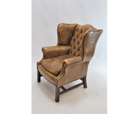Leather button backed armchair