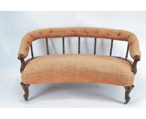 Antique Victorian upholstered sofa with barley twist back on castors. 