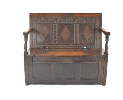 Carved oak storage bench. L105cm x D54cm x H94xm 