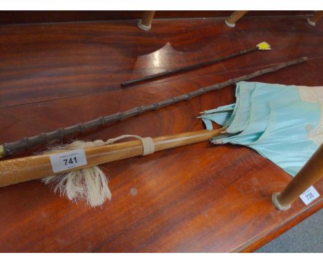 Cream and aqua parasol, cane swagger stick and back scratcher. 