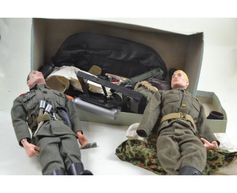 Pair of 1960's action man figures with accessories and clothing.Arm damaged to one. 