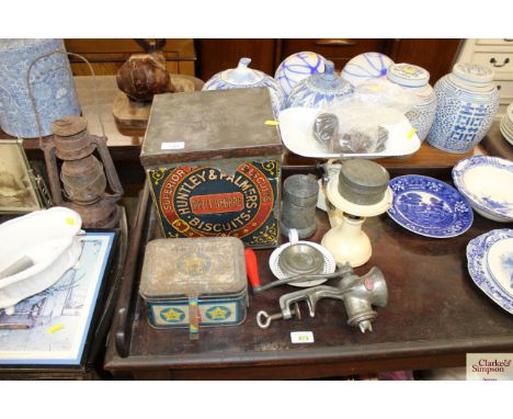 A Huntley &amp; Palmers biscuit tin; an old Spong mincer; kitchen scales and other kitchenalia 