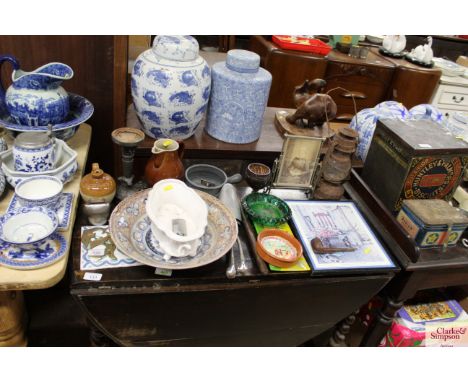 A quantity of various decorative items to include a hurricane lamp, various pottery, shoe trees, a bell, vintage pipe etc. 