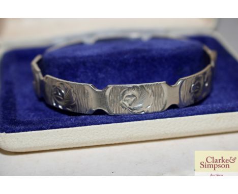 A 1975 Bracelon Ltd. silver bangle, 21gms