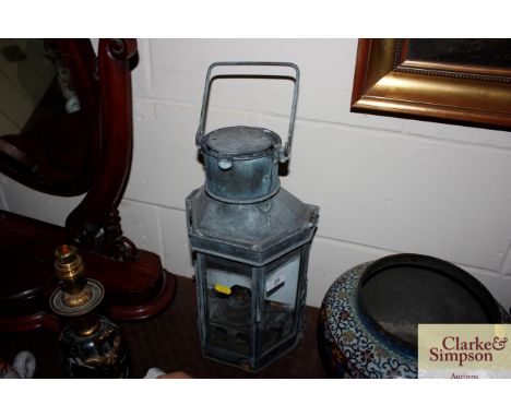 A vintage copper ships lamp