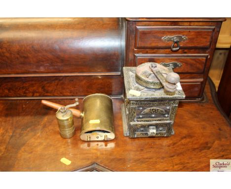 An Eastern coffee grinder; and a brass spice grinder etc.