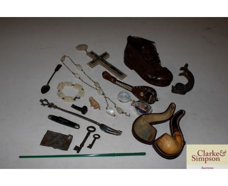 A cased pipe; a model shoe etc.