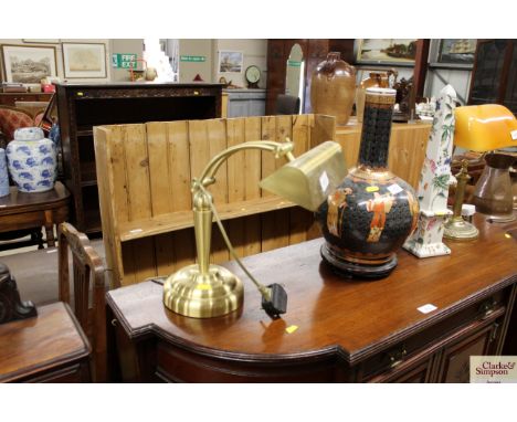 A brass desk lamp