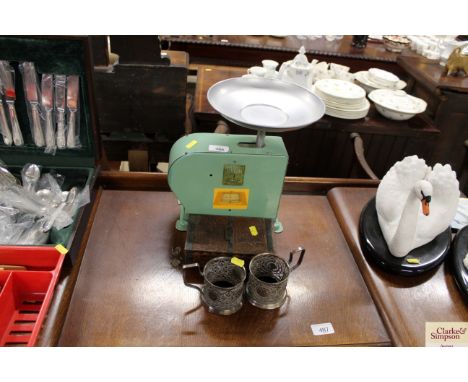 A Kitway set of kitchen scales; two plated cup holders; and a Cadbury Bournville tin
