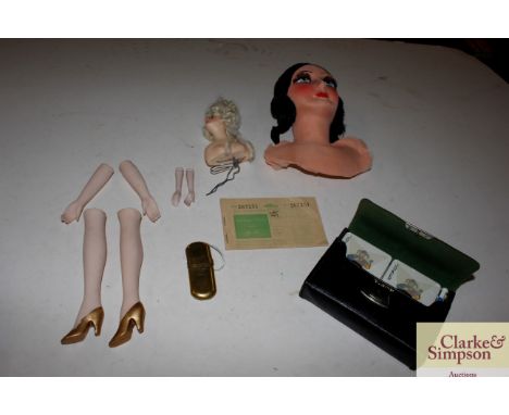 A doll in parts; a Snow White mannequin; and a cased bridge set