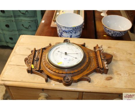 An Alfred &amp; Son a Victorian oak mounted barometer AF
