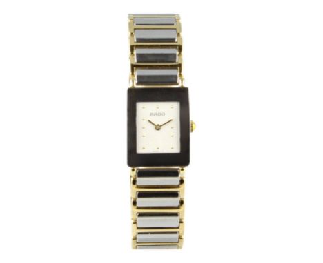 The case is ceramic and stainless steel with Rado engraved back. The bracelet is a mix of ceramic links and gold plated steel