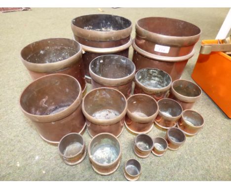 Group of 17 assorted copper and brass Indian measures from 1 payate to 1/64 Sear by the Oriental metal and pressing works, Bo