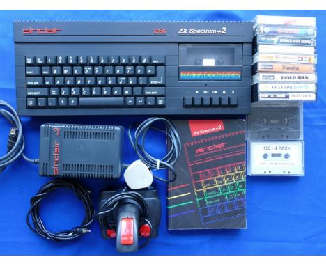 A Spectrum ZX +2A console (black) S No U083443 with power supply unit, TV lead, joystick, manual and a selection of ten games