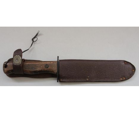 A British Army knife, the 7" blade stamped Wilkinson Sucre, also 27C/2630 broad arrow, scabbard 