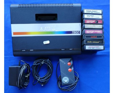 An Atari 7800 games console S No X10A3017658 complete with power unit, TV lead, mini-stick pad controller and eight games, ti