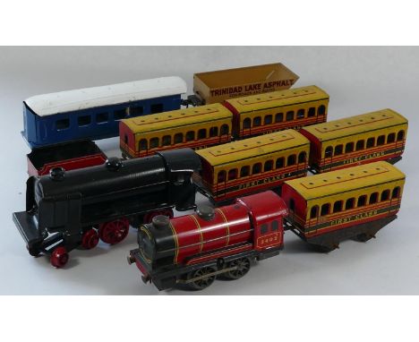 A collection of tin plate model railway to include- two unmarked locomotives, five first class carriages, a blue carriage and
