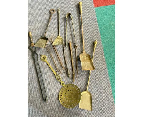 Collection of vintage brass and metal fire tools including shovels, tongs and chestnut warmer  / All lots are located at Gowe