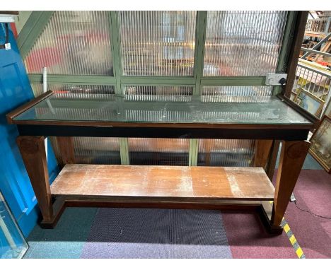 A large two tier wooden console display table with glass top, 93cm (h) x 190cm (w) x 60cm (d)  / All lots are located at Gowe