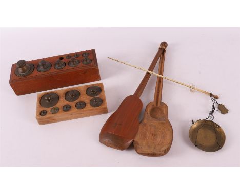 An opium scale in a bamboo holder, early 20th century. Includes bronze weights in wooden block (incomplete), up to. 3x. 