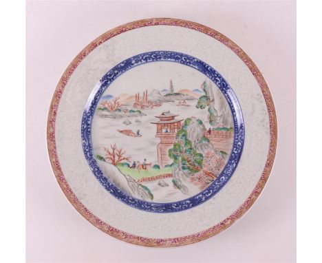 A porcelain famille verte dish, China 19th century. Polychrome decor of a landscape with fisherman and pagoda on the shelf, t