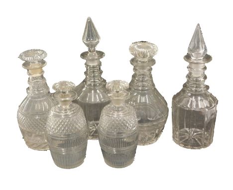 Various 19thC decanters, to include a matched pair with compressed mushroom stoppers, with ring stems and shaped bodies, 27cm