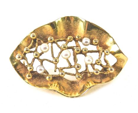 A 9ct gold and pearl brooch, of leaf form, lacking pin back, 5cm long, 6.4g all in. 