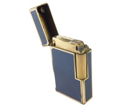 A 20thC Dupont pocket lighter, in blue, with gilt metal trim, marked beneath, 6cm high. 