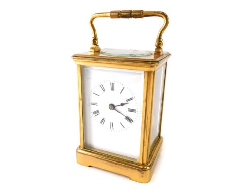A 20thC brass carriage clock, with stencilled Roman numeric dial, before barrel movement, on bracket feet, 14cm high. 