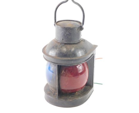 An AFS Genton Limited metal cased port light, with red and black glass, in D end case with swing handle, 34cm high. 