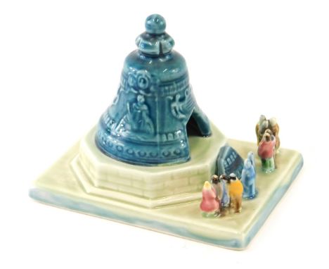A Konakova Russian porcelain figure group, figures before bell, marked beneath, 12cm high. 