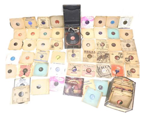 A mid 20thC tabletop gramophone, with winding handle, 24cm high and various records to include Al Jolson, Sunny Boy, other cl