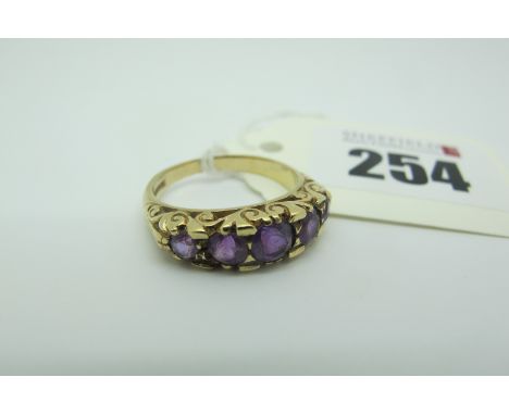 A Victorian Style 9ct Gold Five Stone Ring, graduated set within scroll setting (finger size P) (4grams). 