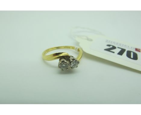 An 18ct Gold Two Stone Diamond Ring, of crossover design, claw set with brilliant cut stones (finger size K1/2). 