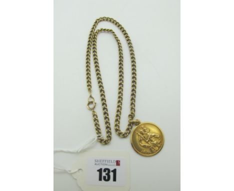 A St. Christopher Medallion Pendant, stamped "375", on a 9ct gold curb link chain (overall weight 29grams). 