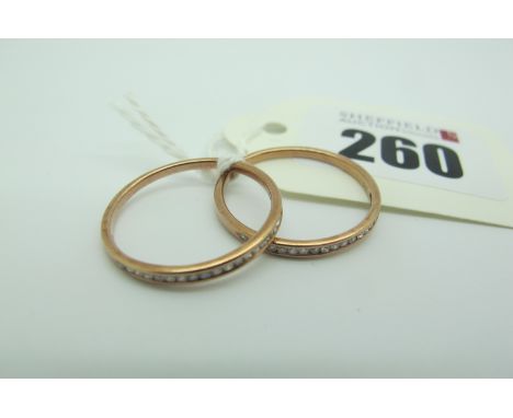 Two Modern QVC 9ct Rose Gold 'Stacking' Rings, of half eternity style, channel set with single cut stones (finger size P1/2) 