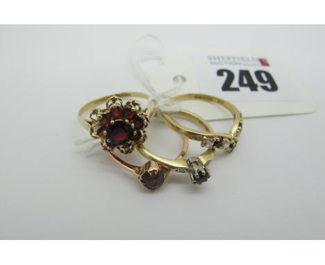 A 9ct Gold Garnet Cluster Ring, claw set throughout, within openwork border, between plain shoulders (finger size M1/2) (2gra