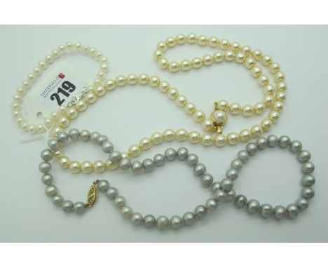 A Single Strand Pearl Bead Necklace, of a silver / grey colour, 42cm long; a pearl bead bracelet, 18cm long and an imitation 