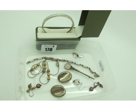 A Modern Hinged Bangle, channel set, stamped "925"; a pair of clip on earrings stamped "Mexico 925", a shell inset line brace