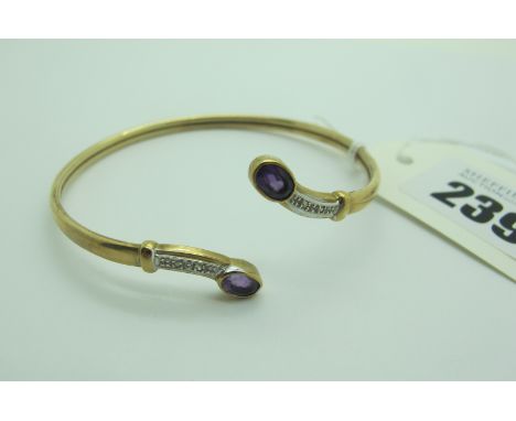 A Modern 9ct Gold Bangle, with oval collet set highlights (6.5grams). 