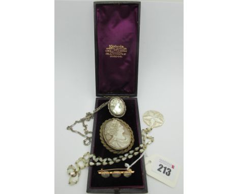 A XIX Century Oval Shell Carved Cameo Brooch, within ropetwist border (lacking pin), a three stone bar brooch, oval collet se