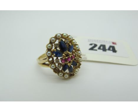 A Modern Cluster Dress Ring, the oval panel claw set, within pearl set border (stones missing), between bifurcated shoulders,