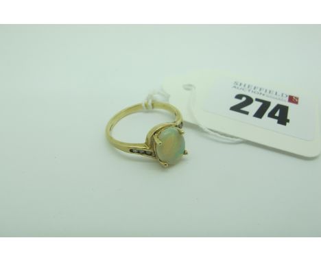 A Modern 9ct Gold Opal Single Stone Dress Ring, oval four claw set, between crossover shoulders (finger size O) (2grams). 