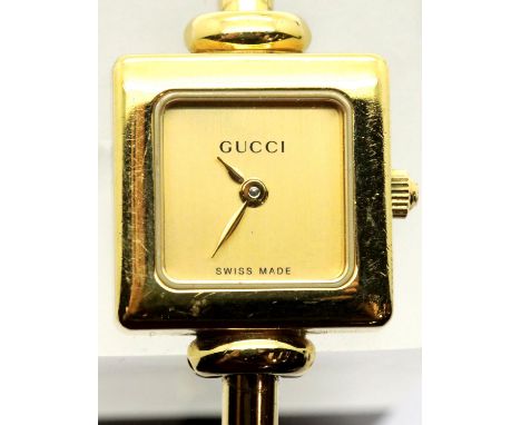 Ladies gold plated Gucci cocktail watch with champagne dial. P&amp;P Group 1 (£14+VAT for the first lot and £1+VAT for subseq