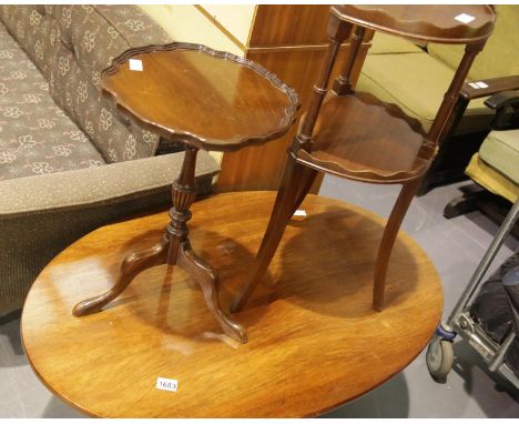 Contemporary mahogany oval coffee table, a reproduction mahogany lamp table and a two tier plant stand. Not available for in-