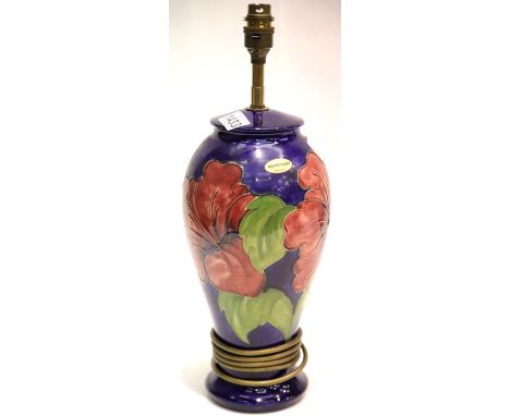 Large Moorcroft blue ground lamp base in the Hibiscus pattern, H: 32 cm. P&P Group 3 (£25+VAT for the first lot and £5+VAT fo