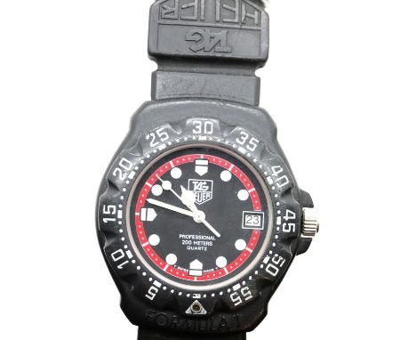 Tag Heuer Professional 200m quartz ladies/youth wristwatch with black rubber strap. P&amp;P Group 1 (£14+VAT for the first lo