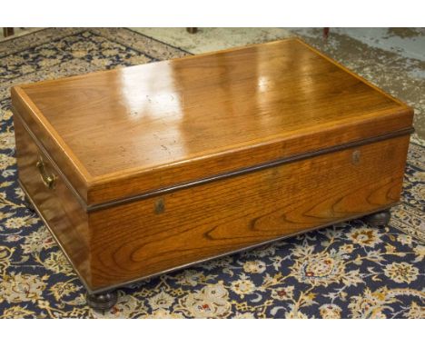 TRUNK, Colonial teak with crossbanded hinged top and brass side handles, 41cm H x 100cm W x 63cm D.