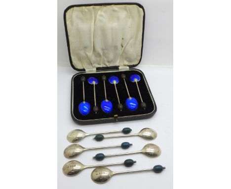 A set of six silver and blue enamel coffee bean spoons, (enamel chipped on two) and a cased set of six silver coffee bean spo